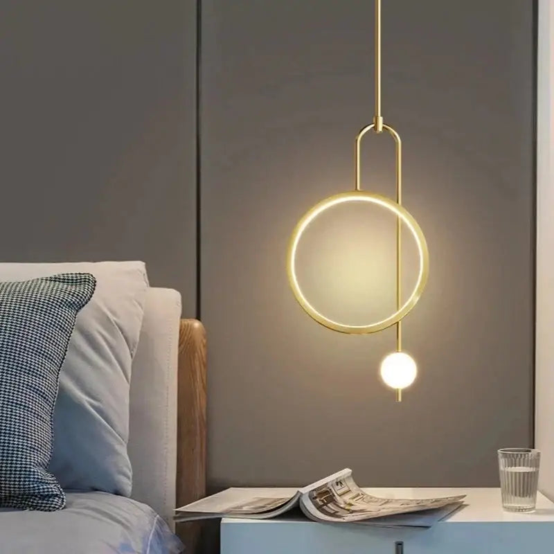 Gold-toned minimalist decorbites led ring pendant chandelier with circular ring and spherical bulb for dining and living areas