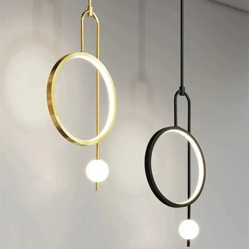 Modern decorbites led ring pendant chandelier with circular led rings and spherical bulbs in gold and black finishes