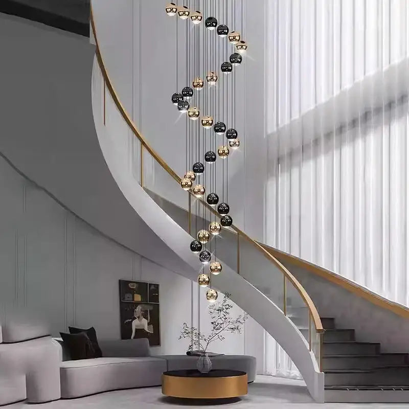 A modern spiral staircase with white finish and gold handrail beneath a decorbites led ring pendant light size diameter