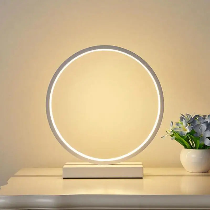 Modern nordic decorbites led ring table lamp with sleek white frame and warm glow on minimalist base