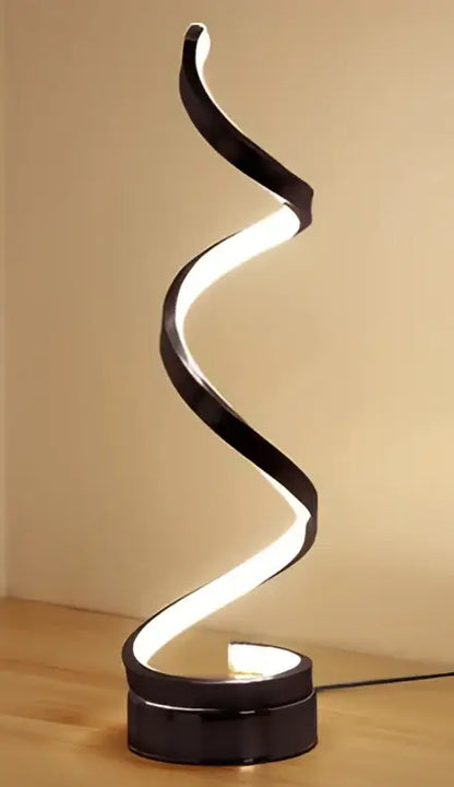Black spiral led ring table lamp with sleek modern design and illuminated inner curve for nordic bedroom lighting