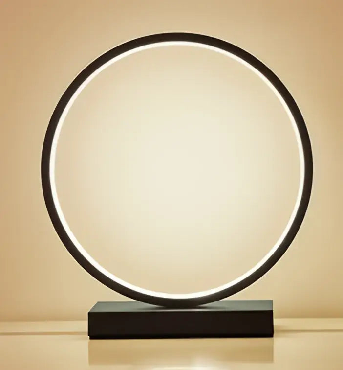 Decorbites™ led ring table lamp with sleek black frame and glowing white light on matching rectangular base for modern lighting