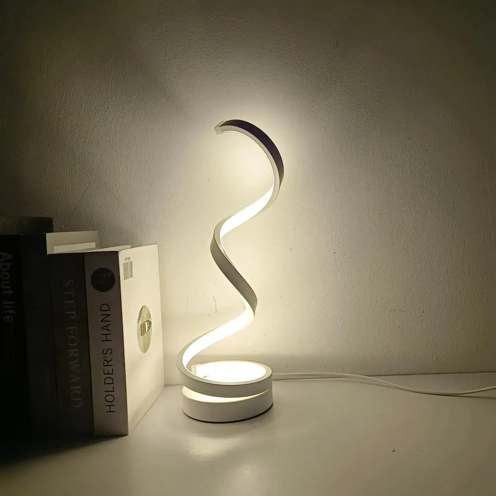 A sleek modern white DecorBites™ led ring table lamp with spiral design and illuminated edges for bedroom lighting