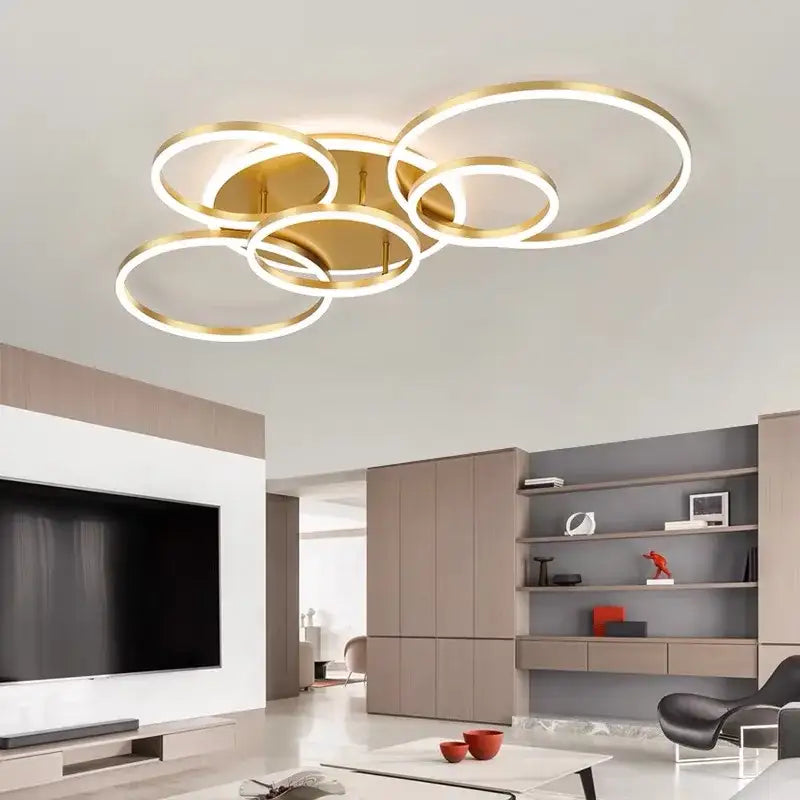 Modern gold-toned decorbites™ led rings ceiling chandelier with overlapping rings and illuminated edges for living room