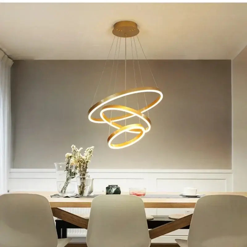 Gold-toned modern pendant decorbites™ led rings ceiling chandelier with three interlocking circular rings for home decoration