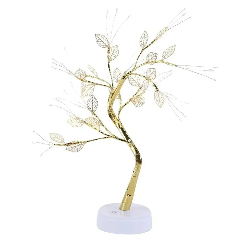 Golden wire tree fairy lamp with leaf-shaped cutouts and curved trunk on white base for christmas tree decoration