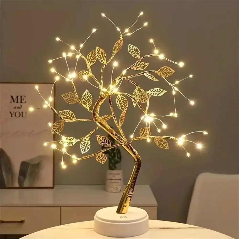 Golden led tree fairy lamp with intricate leaf designs and warm glowing lights for christmas tree decoration