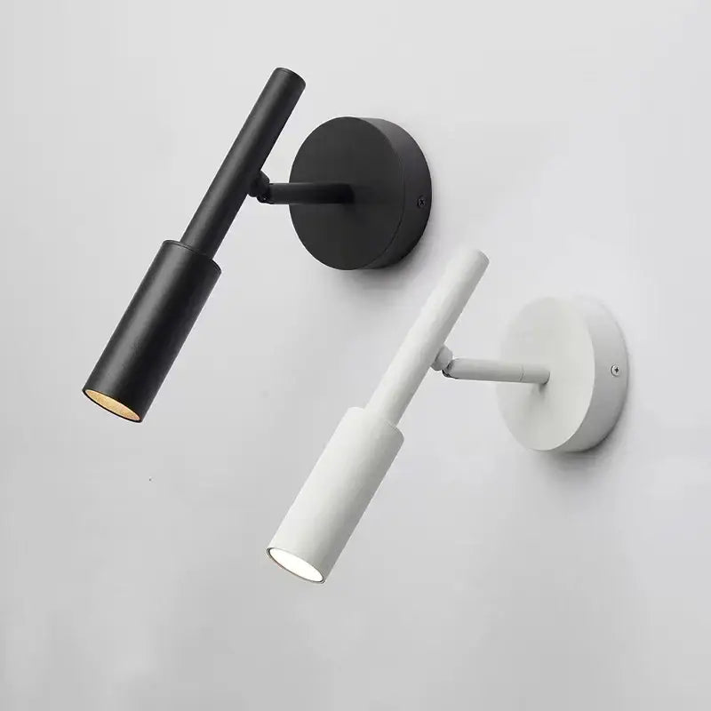 Modern black and white metal decorbites led rotatable wall lamp with sleek cylindrical design for reading use