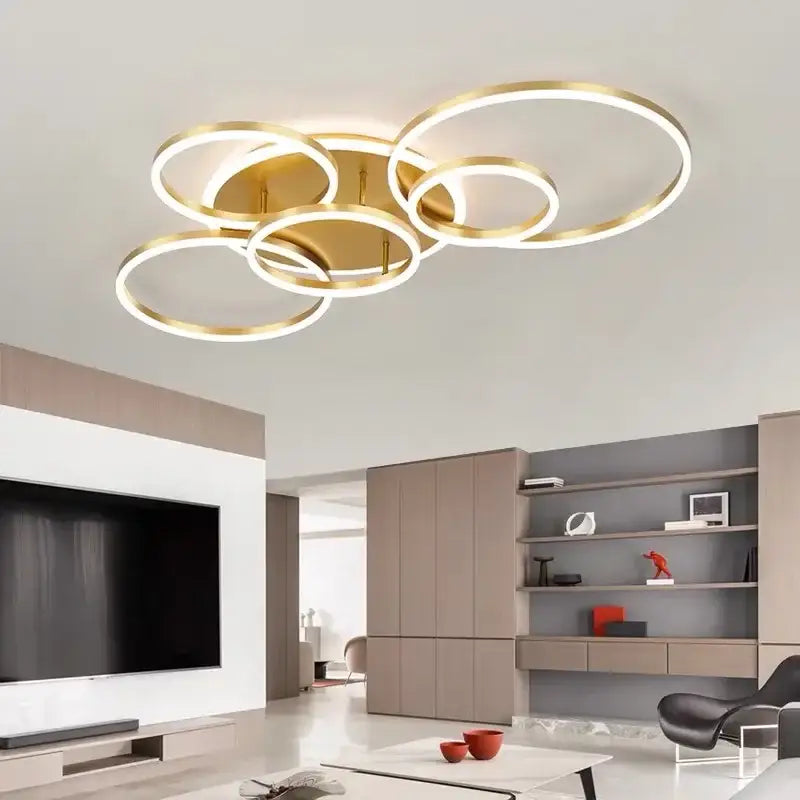Modern gold-toned DecorBites™ led round ceiling chandelier with overlapping circular rings for living rooms and bedrooms