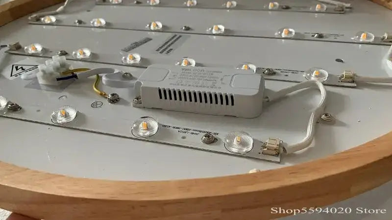 Back view of white rectangular led driver with ventilation slots mounted on dekorbites™ ultra-thin led round ceiling light panel