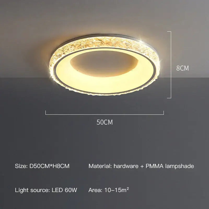 Decorbites™ round ceiling light with remote control features a metallic frame and crystal elements with warm yellow glow