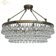 Brass-finished DecorBites led round glass chandelier with teardrop crystal pendant lights for modern living spaces