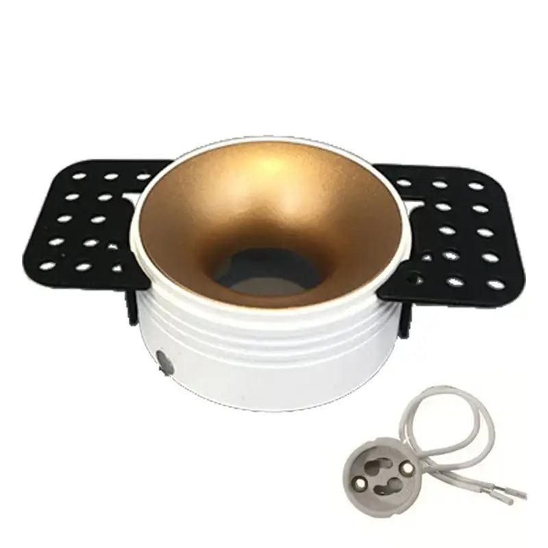 White and gold decorbites led round recessed ceiling light fixture with black perforated side brackets and gu10 socket holder