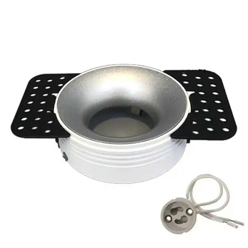 White and silver DecorBites LED round recessed ceiling light with black perforated side panels for modern lighting