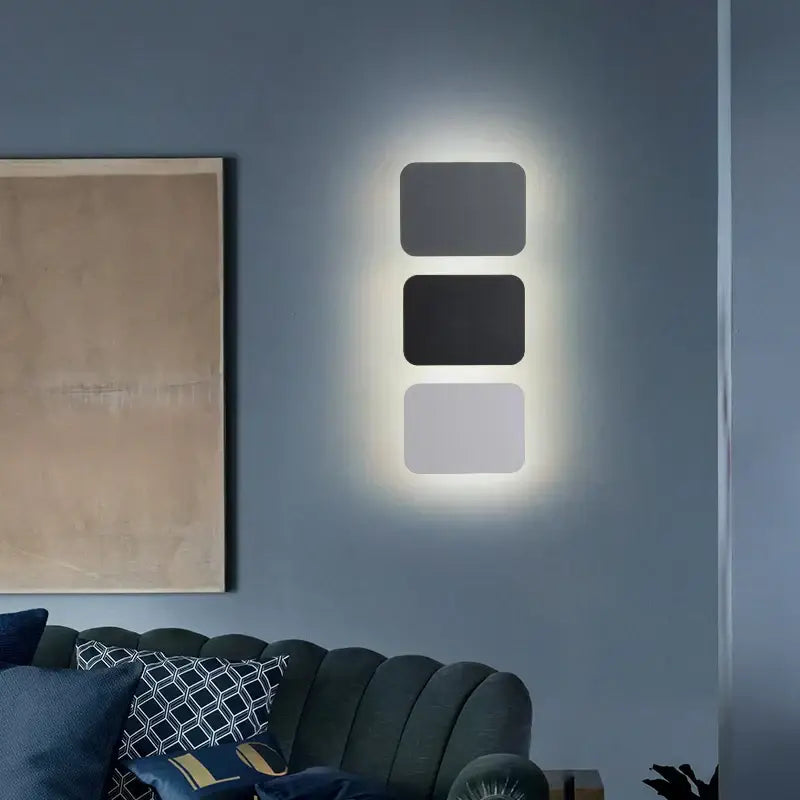 Modern minimalist decorbites led round touch wall lamps with three matte black and gray panels emitting soft glow