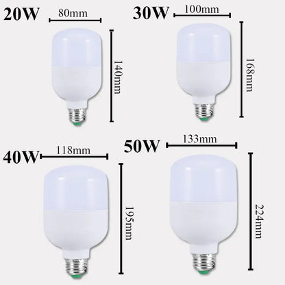 Four white DecorBites™ LED round UFO ceiling light bulbs with varying wattages and standard screw bases for indoor use