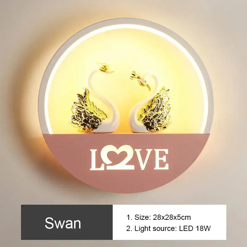 Circular DecorBites LED round wall lamp with white swans gold-leafed wings warm yellow backlight for children room