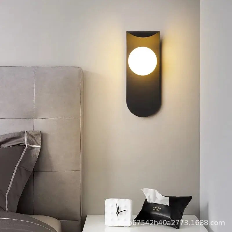 Modern black wall lamp with sleek curved design and warm circular light decorbites led round for living room lighting