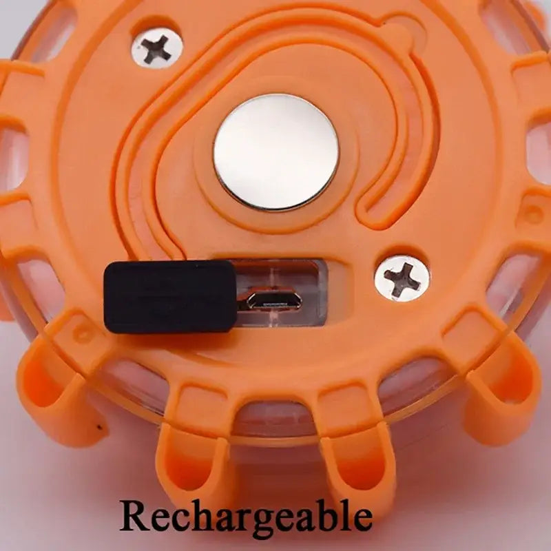 Orange plastic circular reflector with usb-c connector and screws on the back of decorbites led safety flare light