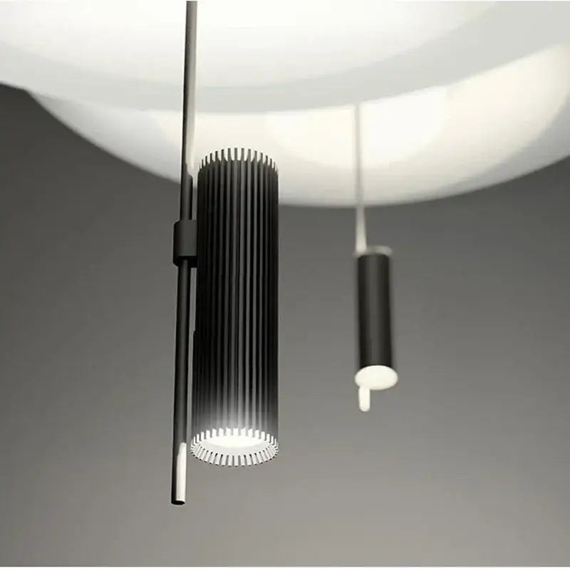 Black cylindrical led saucer chandelier with vertical ridges and glowing white base for modern home decor