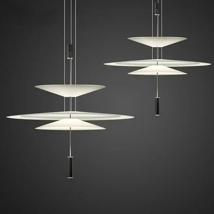 Modern white tiered pendant light with sleek black cylindrical accents decorbites led saucer for living room decor