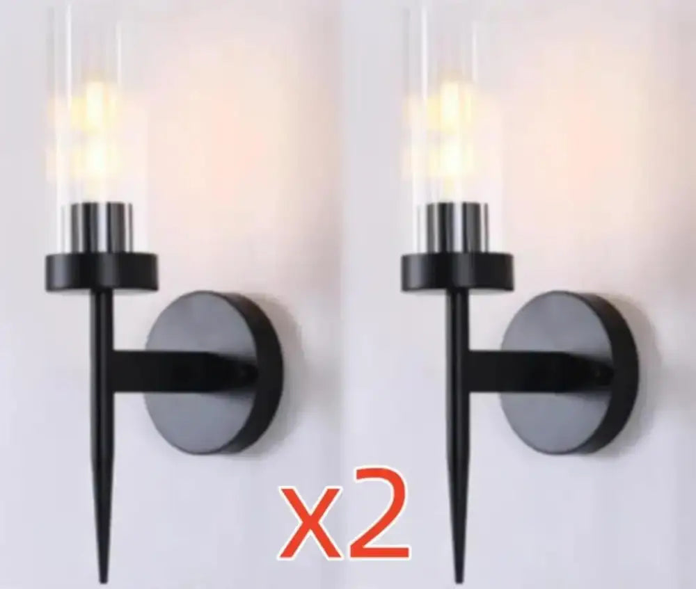 Black modern metal decorbites led sconce light with clear glass cylinder housing led bulb for bedroom and home use