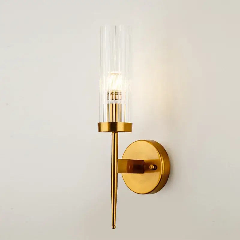 Gold-toned metal decorbites led sconce with clear glass cylinder and exposed bulb for bedroom and home use