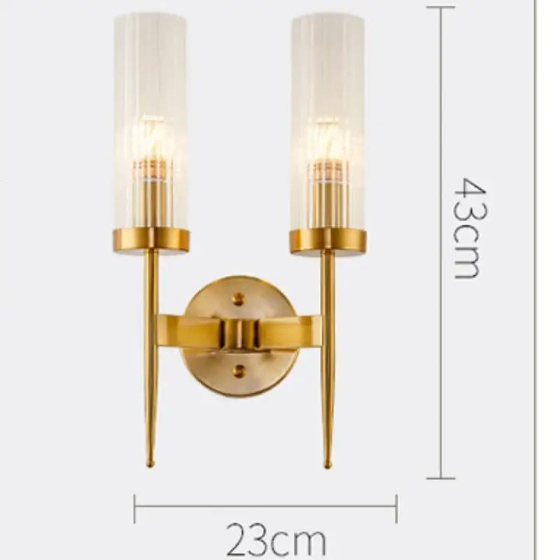 Gold-toned decorbites led sconce with two frosted glass shades and slender metal arms for bedroom and home lighting