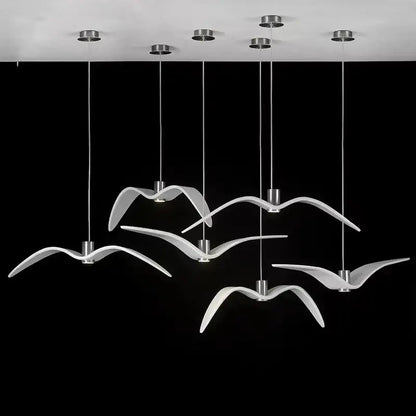 Modern white seagull-shaped pendant lights with sleek metallic fixtures in decorbites led seagull chandelier design