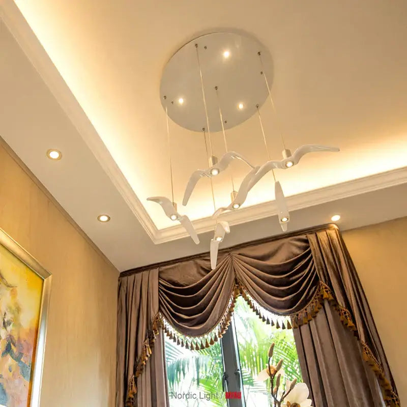 White sculptural bird-shaped decorbites led seagull chandelier with metallic accents and embedded led bulbs for villa decor