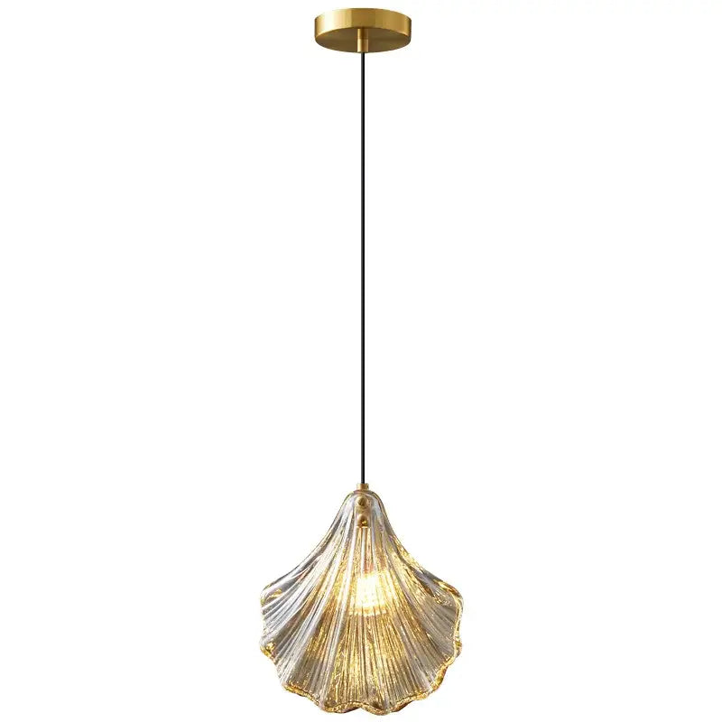 Decorbites led shell pendant light with translucent glass shell and brass mount emitting warm golden glow