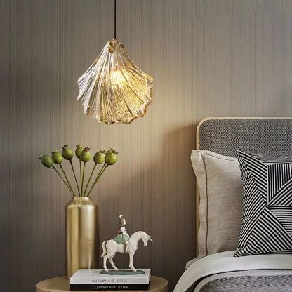 DecorBites led shell pendant light with translucent golden shell design emitting a warm glow for modern interiors
