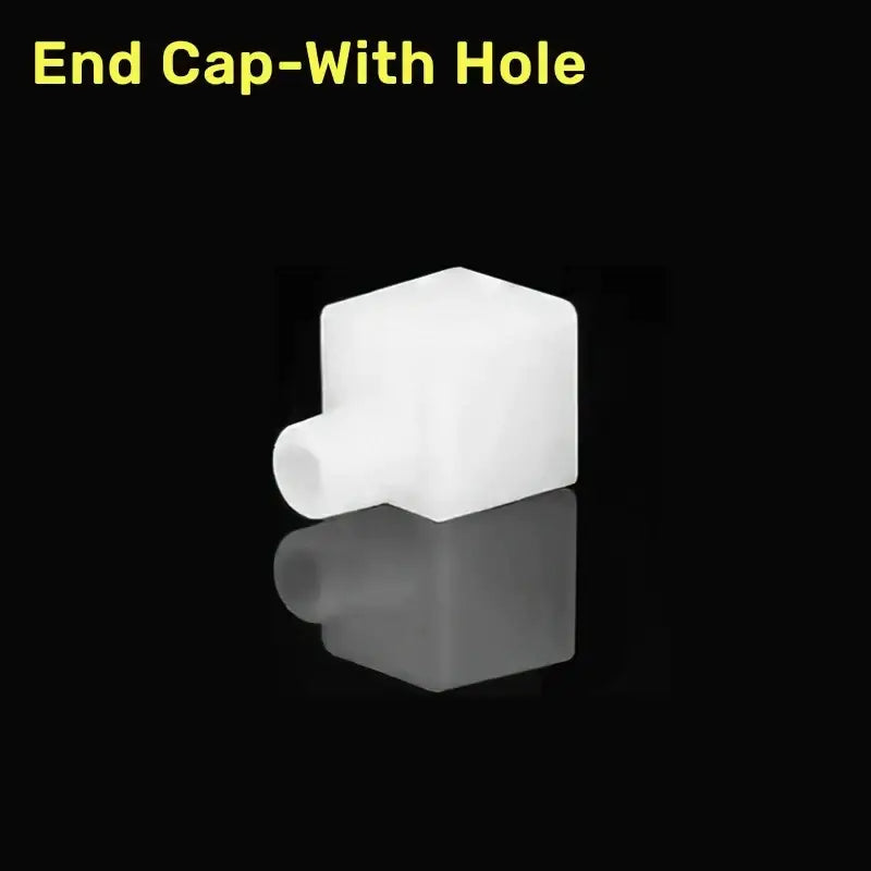 White plastic end cap with cylindrical hole for silicone tube in DecorBites™ led strip light connector kit