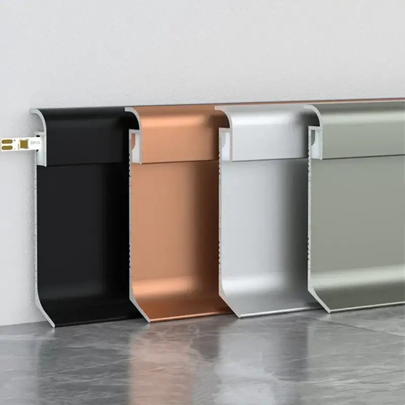 Four metallic decorbites™ led skirting line aluminum profiles in black copper silver and sage green for stylish lighting and trim
