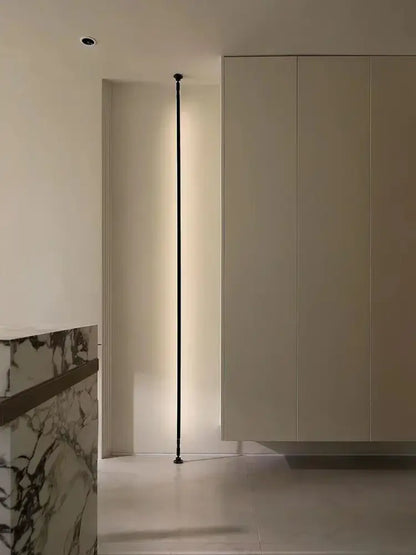 A sleek black minimalist decorbites led skyline floor lamp with slender vertical design and integrated led lighting