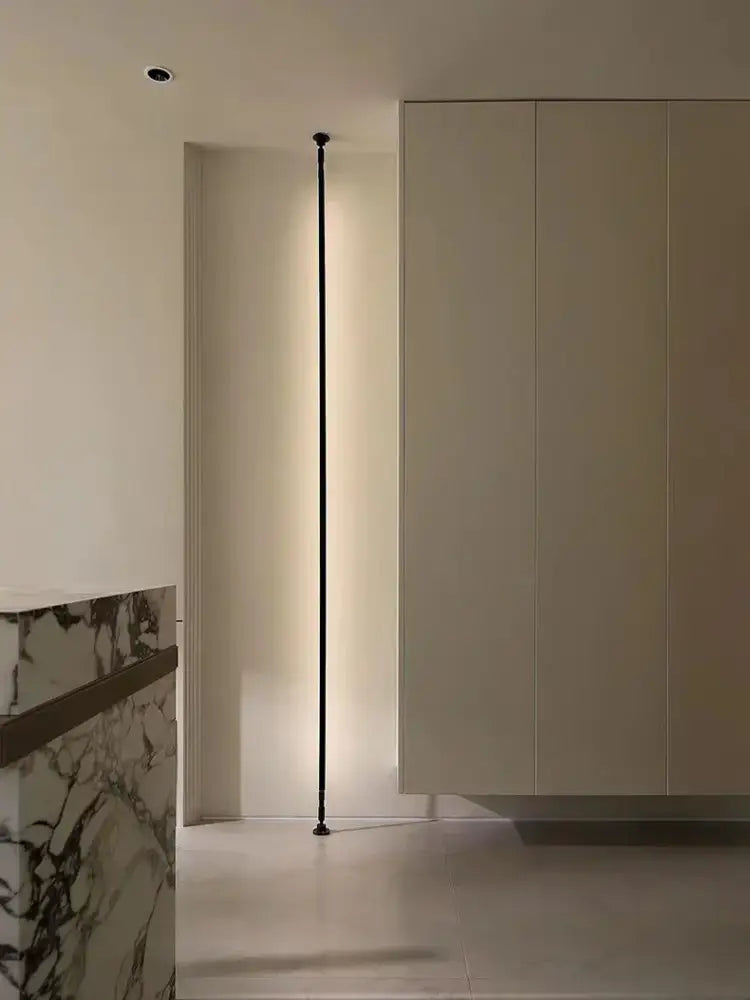 A sleek black minimalist decorbites led skyline floor lamp with slender vertical design and integrated led lighting