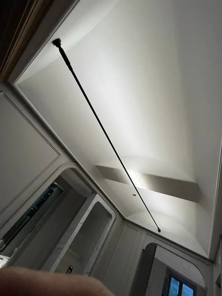 A sleek black telescopic decorbites led skyline ceiling wall light fixture with modern minimalist design for home lighting