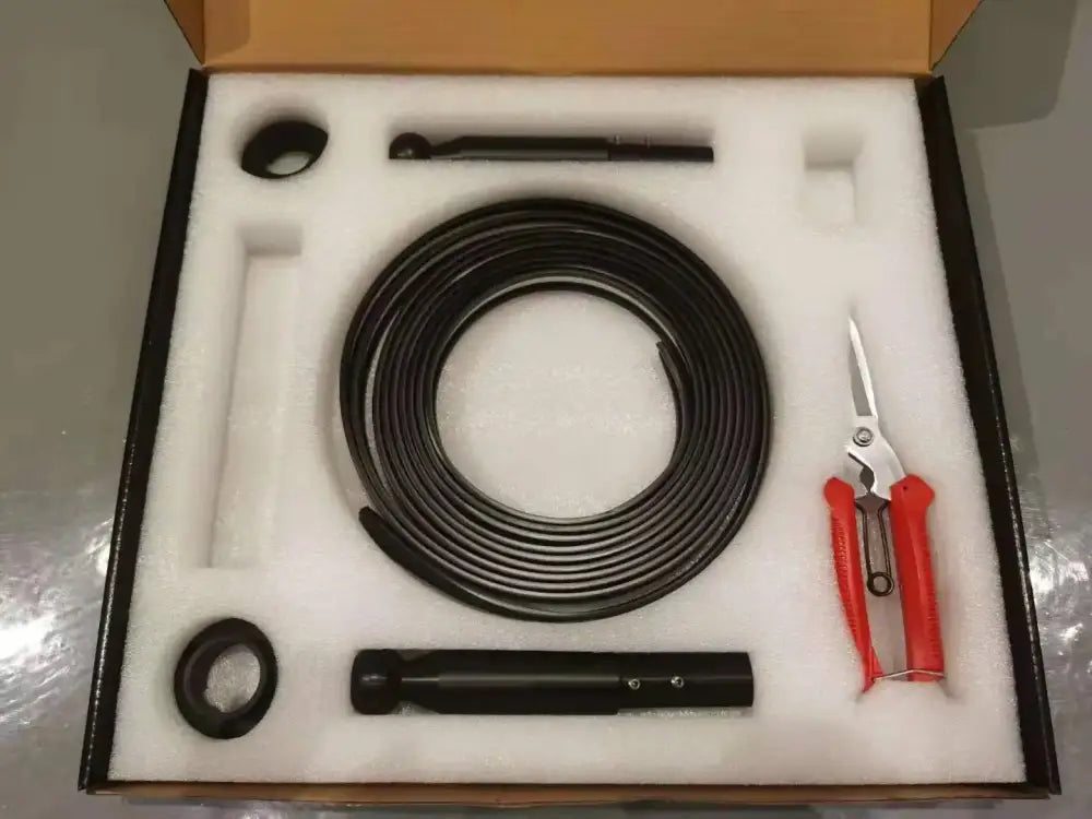 Black coiled inspection camera cable set with red scissors and accessories in foam packaging for decorbites led skyline steel pendant lights