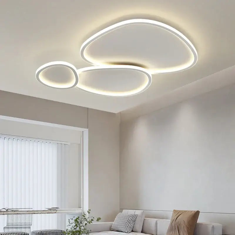 Modern white decorbites led smart chandeliers feature sleek cloud-like oval shapes with glowing edges for bedroom lighting
