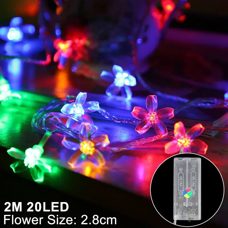 Colorful flower-shaped led snowflake christmas string lights with translucent petals and clear wire for christmas home decorations
