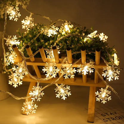 String of warm white led snowflake christmas home decorations with clear plastic bulbs and thin wire by decorbites