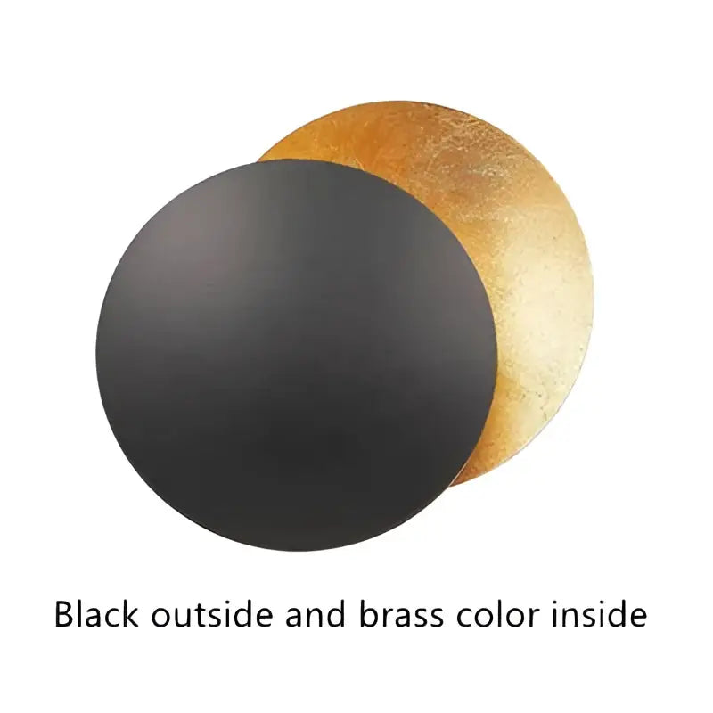 Black and brass circular cake board with matte black exterior and shiny gold interior for decorbites led solar eclipse wall lamp