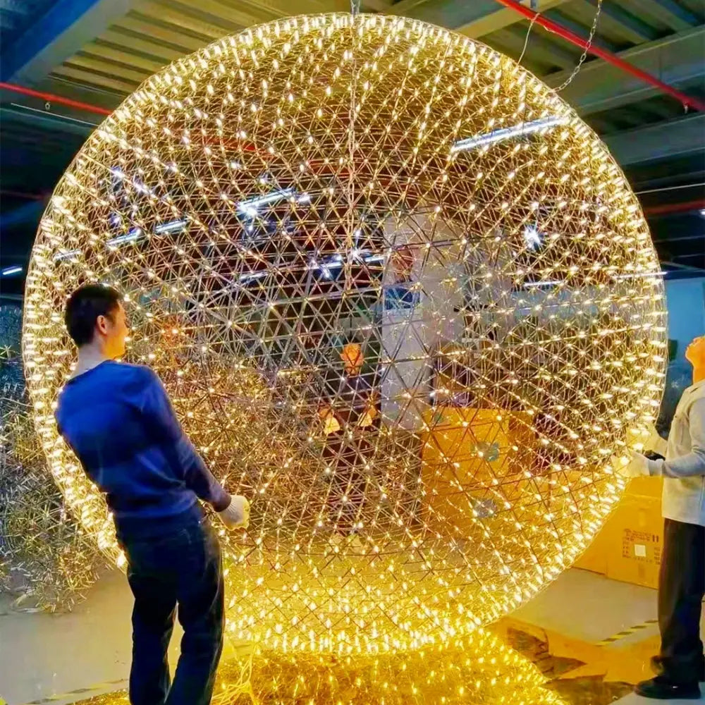Decorbites led spark ball pendant light with a large glowing golden spherical design made of illuminated wires