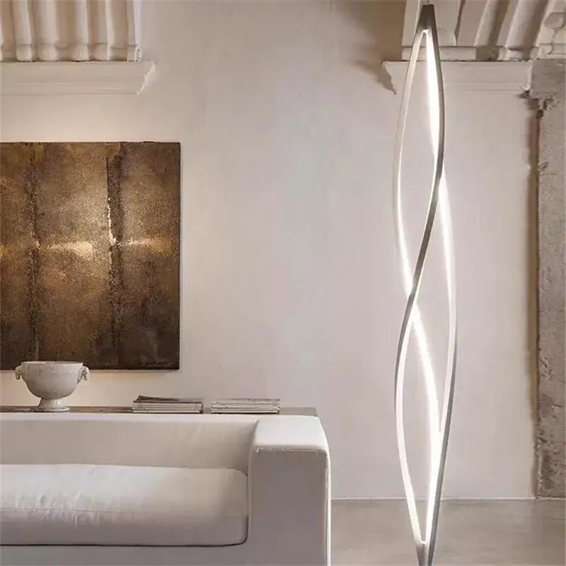 A sleek modern decorbites led spiral aluminum floor lamp with wave-like design and illuminated led strip for home use