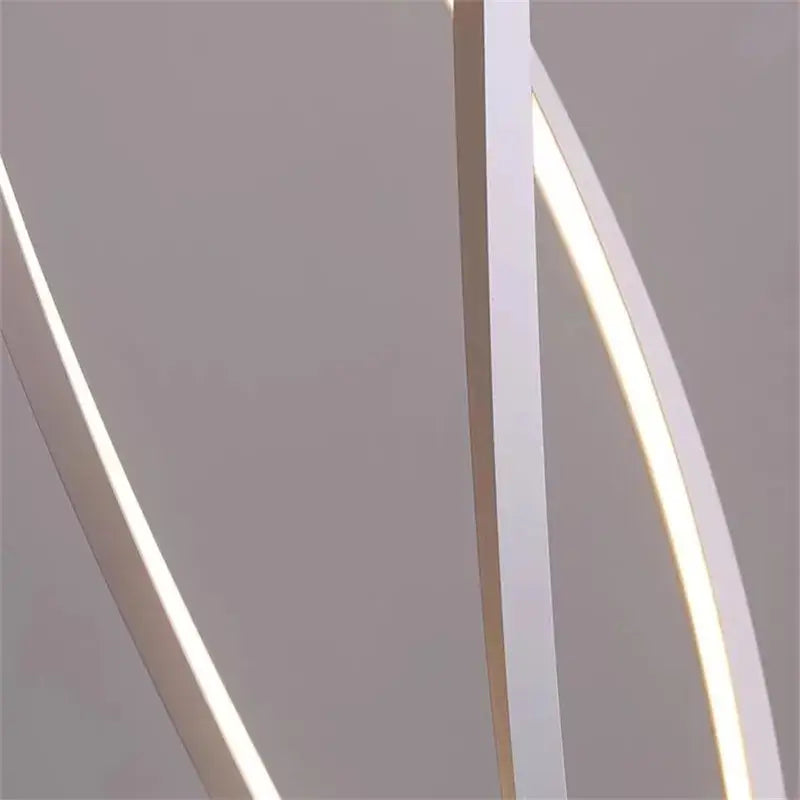 Modern white LED spiral aluminum light fixture with sleek curved design from DecorBites for home and office decor