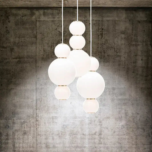 White spherical glass decorbites led spiral ball pendant with gold-toned metal accents for modern lighting decor