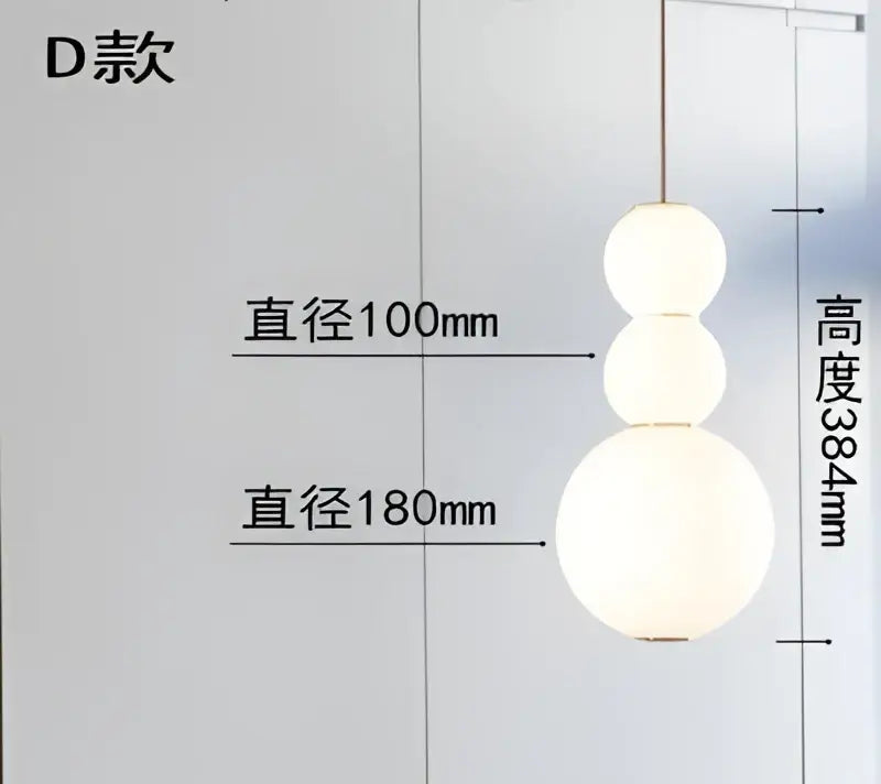 A decorbites led spiral ball pendant with three stacked off-white matte spherical shades for modern nordic decor