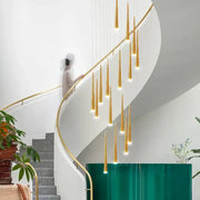 Golden slender decorbites led spiral chandelier with black chrome gold pendants hanging above modern staircase