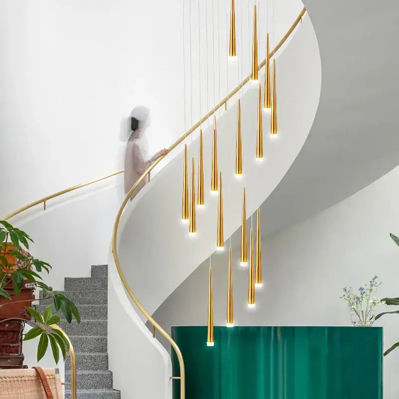 Golden slender decorbites led spiral chandelier with black chrome gold pendants hanging above modern staircase