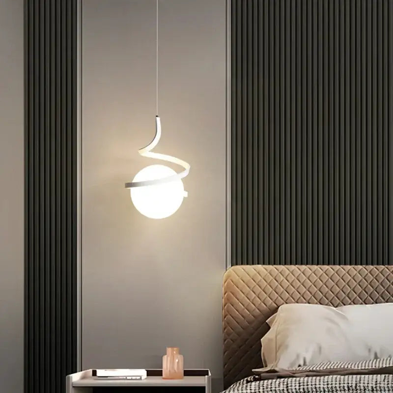 Modern white pendant light with sleek curved metallic arm and spherical glass shade from decorbites led spiral pendant